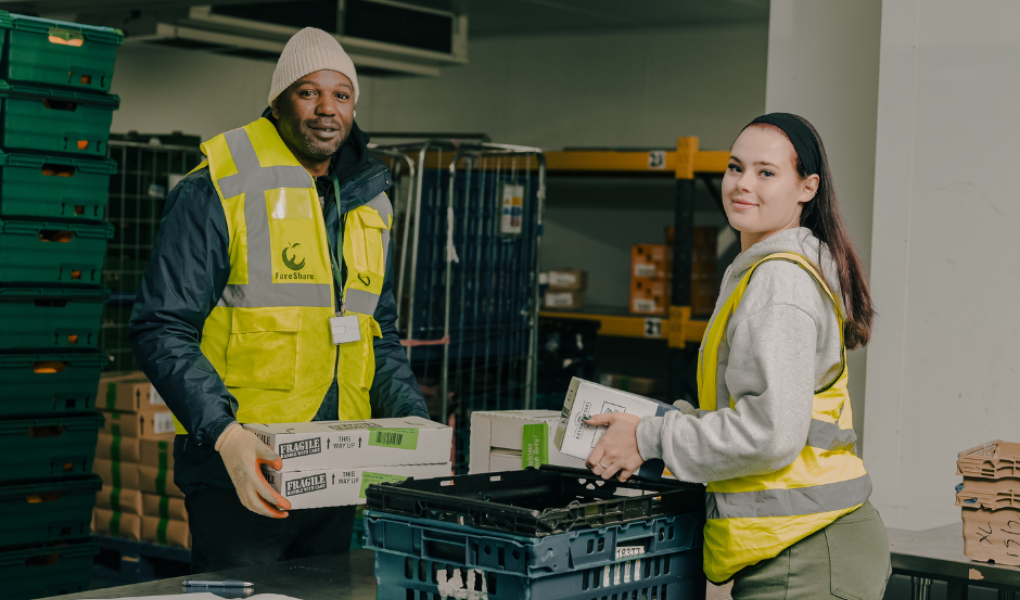 Two warehouse volunteers handling deliveries